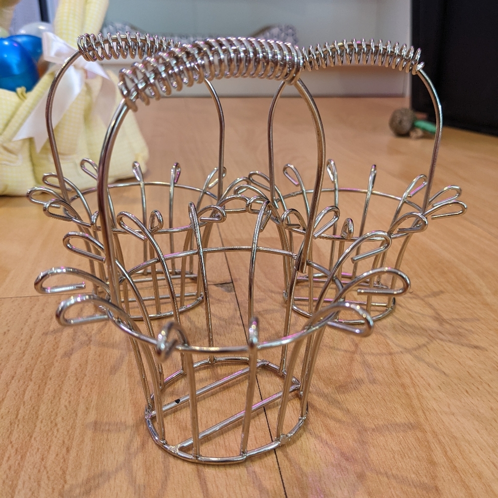 Set of four round metal baskets